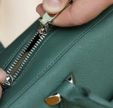 Close Up Of A Saffiano Leather Bag Being Opened