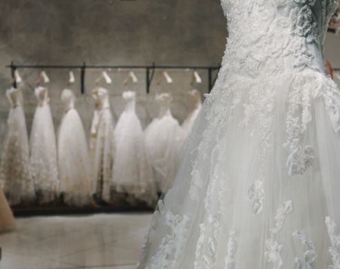 beautiful wedding dress hanging for drying