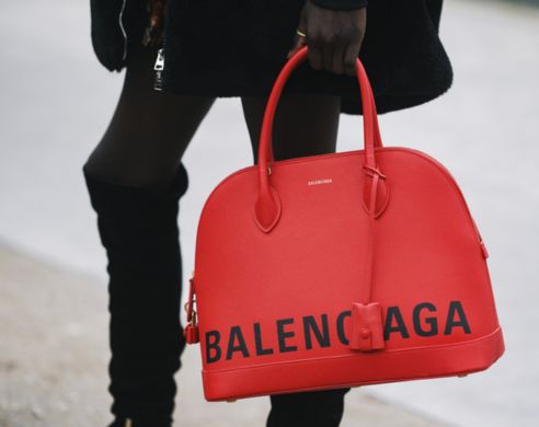 close up of a red balenciaga handbag