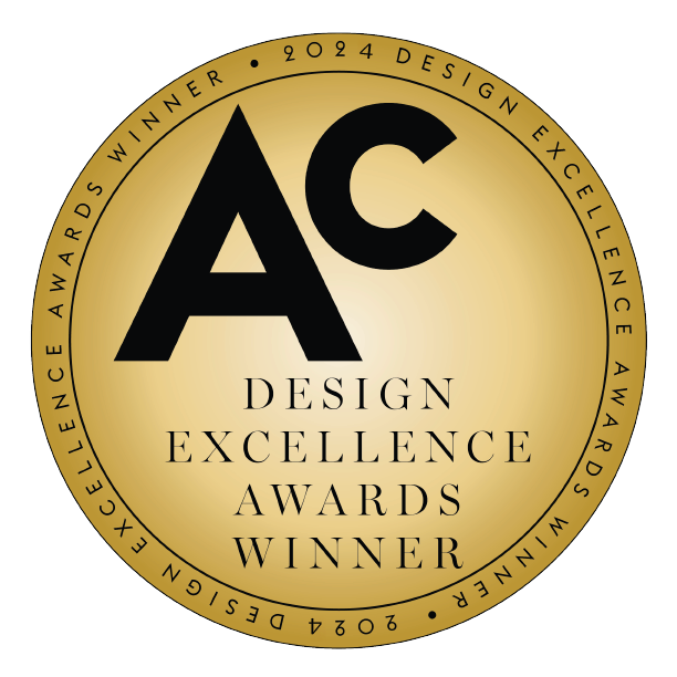 Gold Circular Badge With "ac" In Bold Letters, Surrounded By The Text "design Excellence Awards Winner 2024.