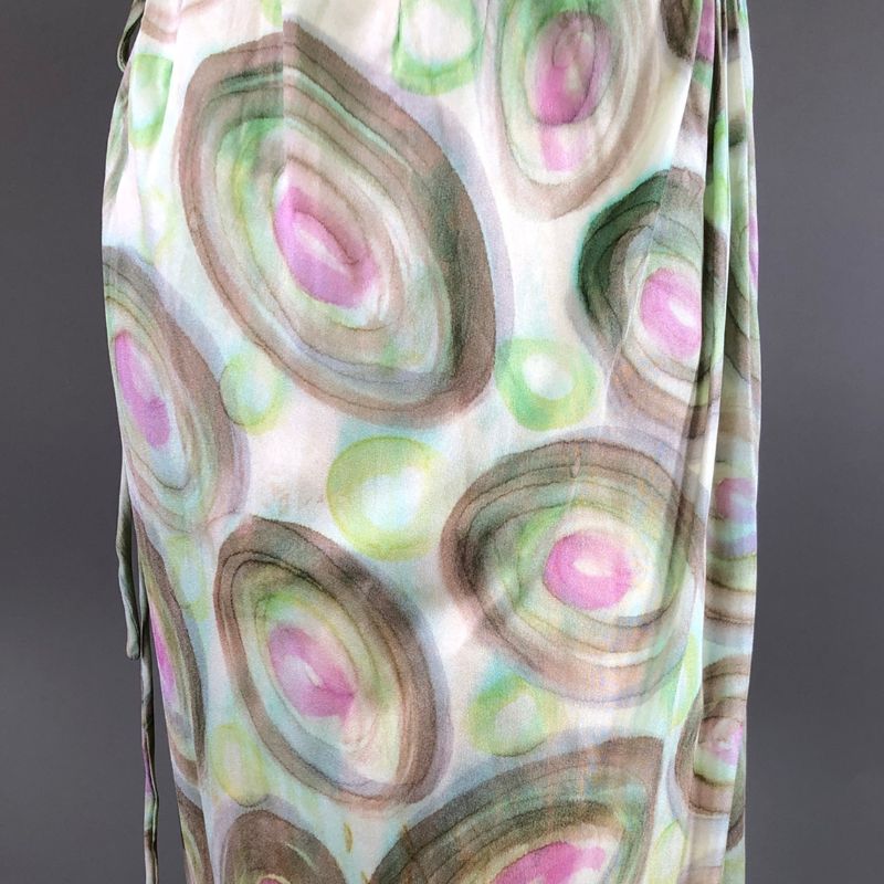 Close Up Of Fabric From A Jean Louis Designer Dress With A Circular, Abstract Pattern In Shades Of Pink, Green, And Brown, Echoing The Hollywood Heritage Style Marilyn Monroe Once Adored.
