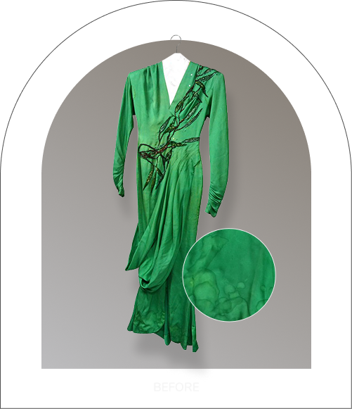 Green dress before restoration with stains and tears