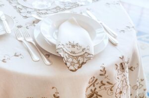 Embroidered cutwork tablecloth and napkin cleaned and pressed by Margaret’s