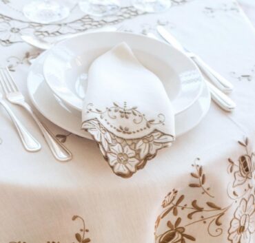 Embroidered cutwork tablecloth and napkin cleaned and pressed by Margaret’s